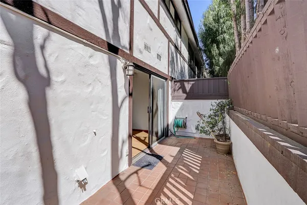 a view of balcony with furniture
