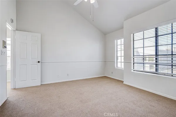 an empty room with a empty space and windows