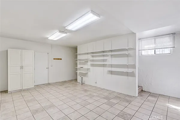 a view of an empty room and closet area