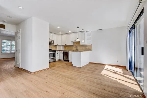 a view of kitchen with wooden floor