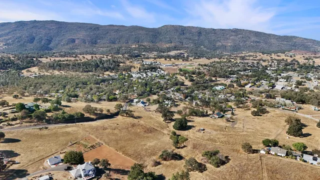 a view of a town with mountains in the background