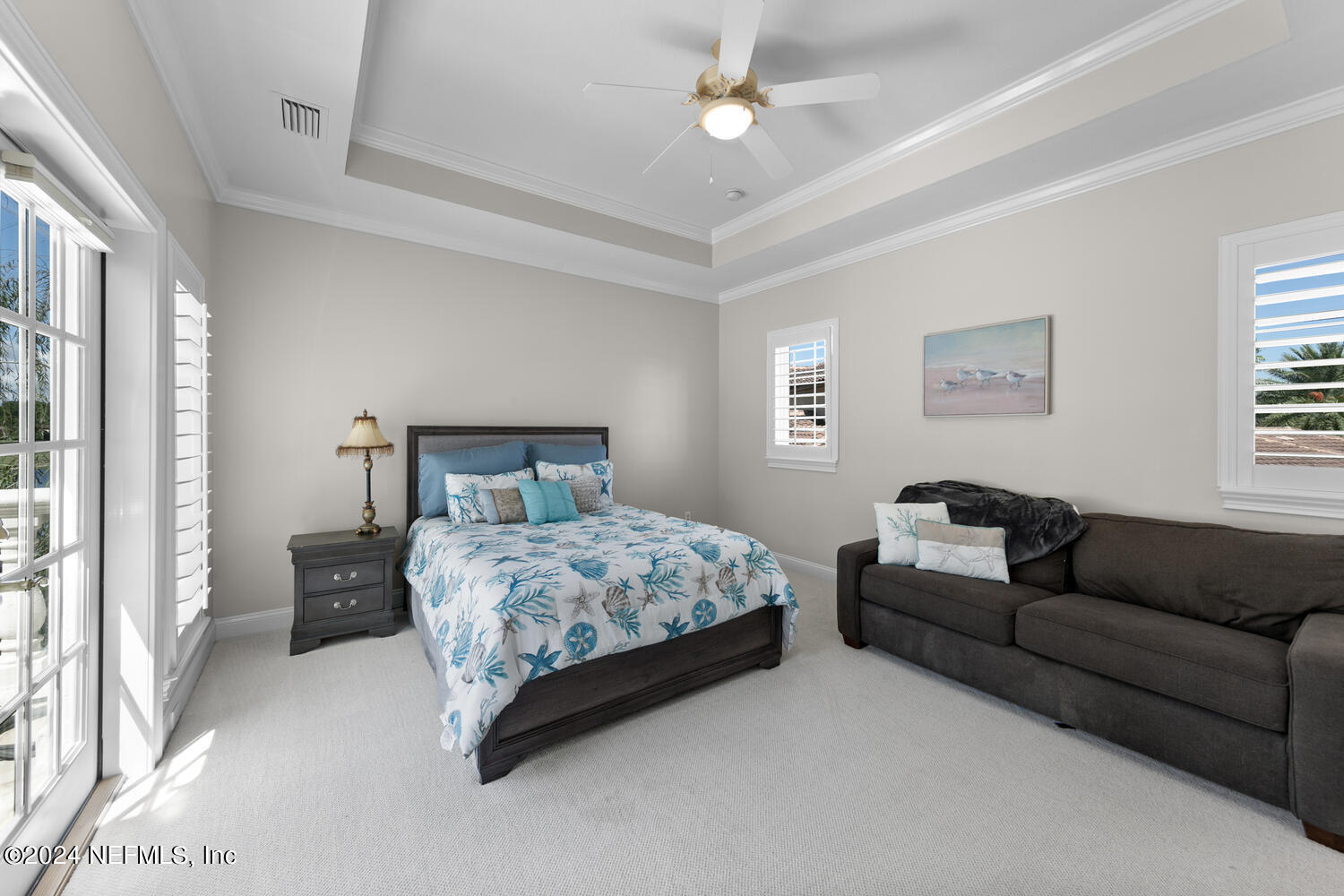 752 Promenade Pointe Drive St. Augustine, FL 32095 - Photo 54 of 117 a bedroom with a bed couch and window