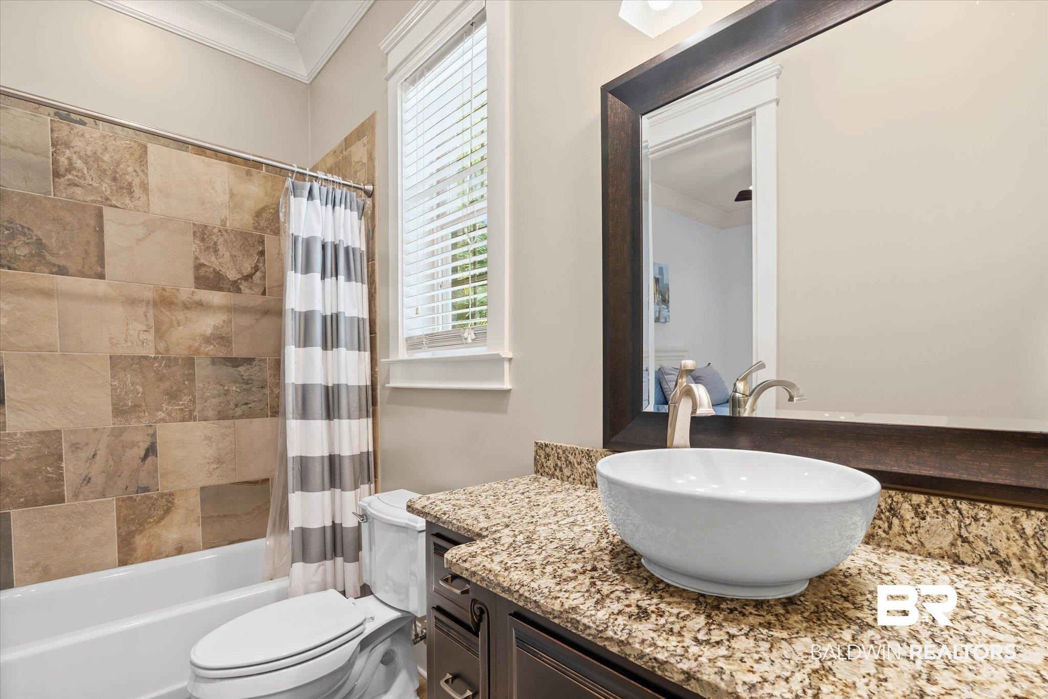 7676 Rockstone Lane Mobile, AL 36695 - Photo 22 of 47 Bathroom with crown molding, vanity, and shower / bathtub combination with curtain