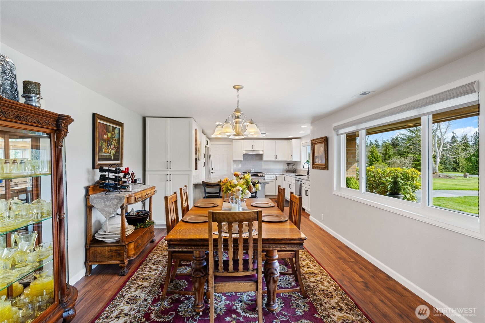 802 Haddon Road Anacortes, WA 98221 - Photo 11 of 36 a view of a dining room with furniture window and wooden floor