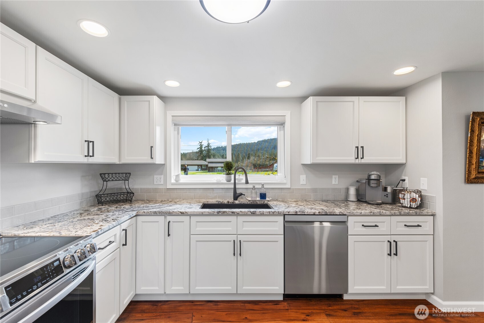 802 Haddon Road Anacortes, WA 98221 - Photo 16 of 36 a kitchen with a sink cabinets and window
