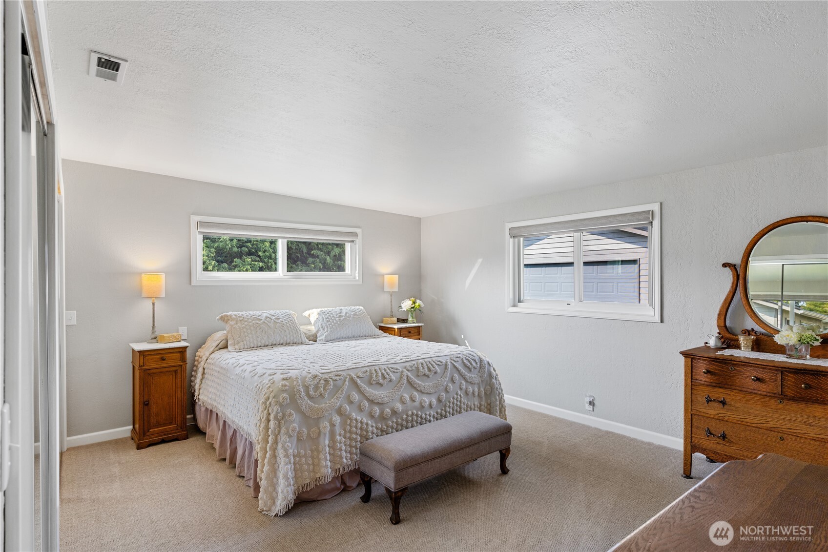 802 Haddon Road Anacortes, WA 98221 - Photo 18 of 36 a bedroom with a bed and a dresser