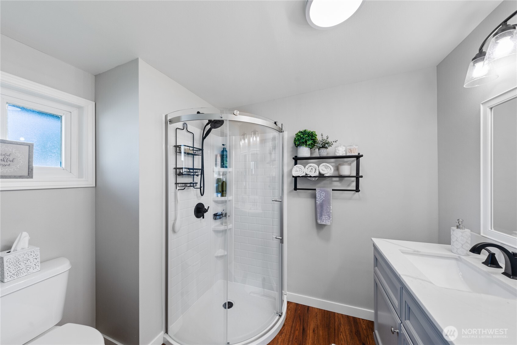 802 Haddon Road Anacortes, WA 98221 - Photo 20 of 36 a bathroom with a shower sink and toilet