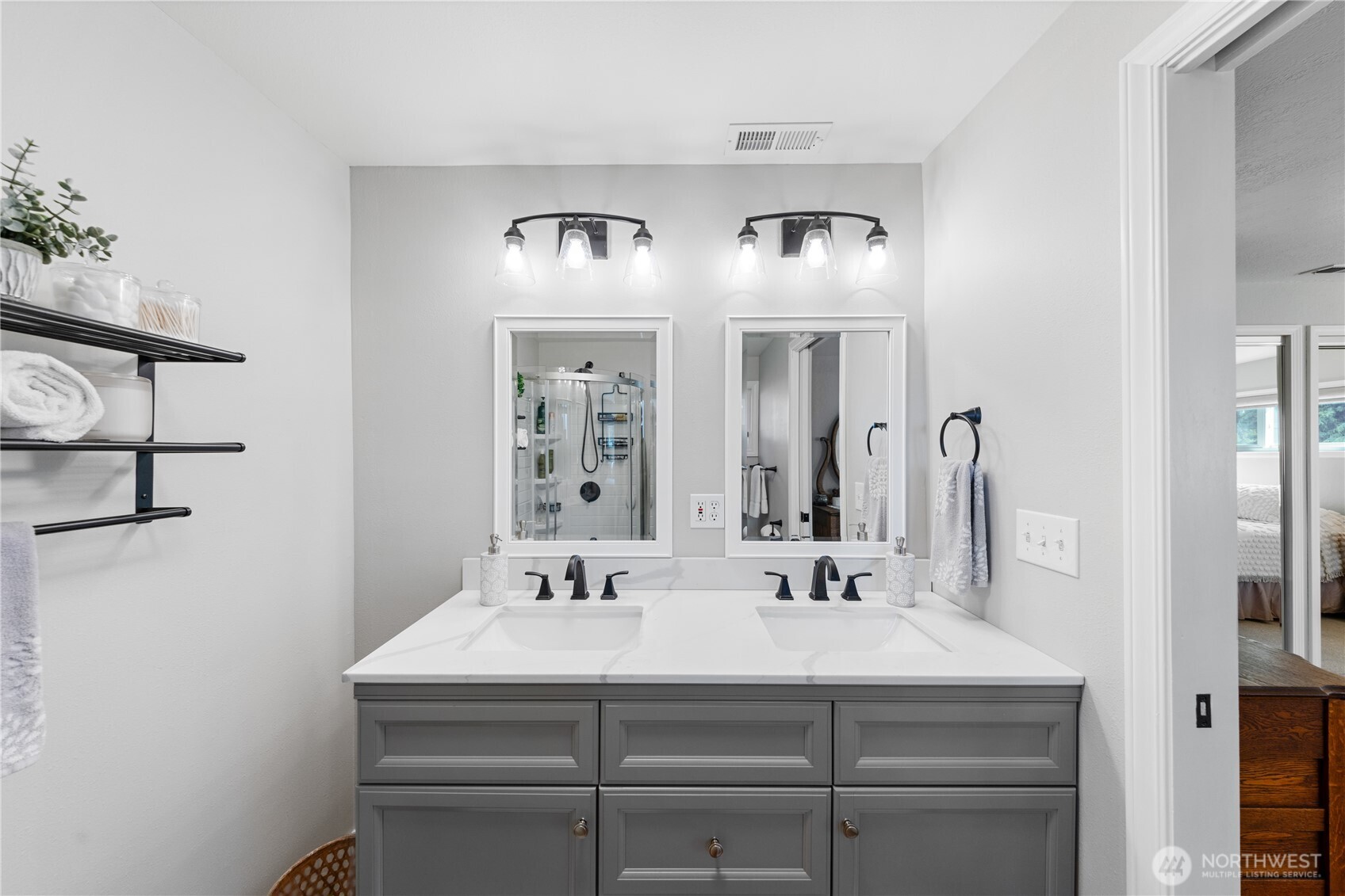 802 Haddon Road Anacortes, WA 98221 - Photo 22 of 36 a bathroom with a sink and a mirror