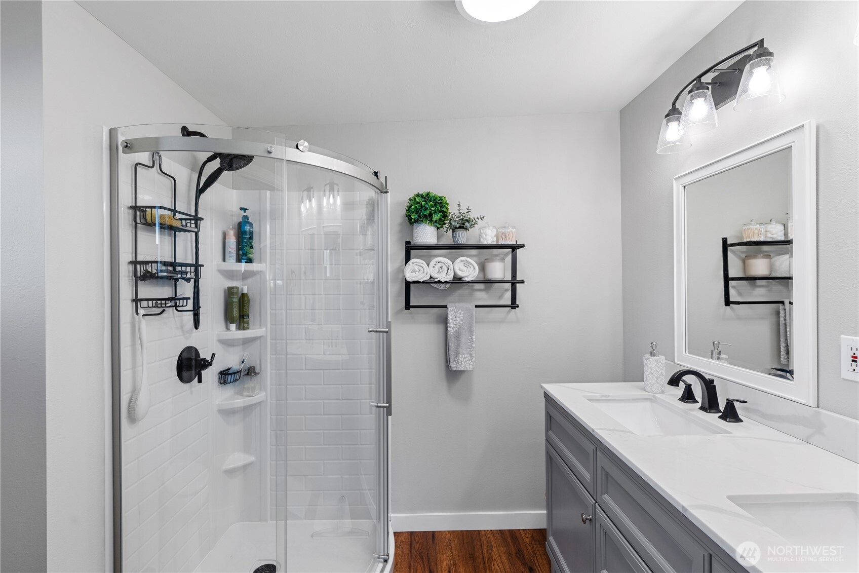 802 Haddon Road Anacortes, WA 98221 - Photo 23 of 36 a bathroom with a shower sink and mirror
