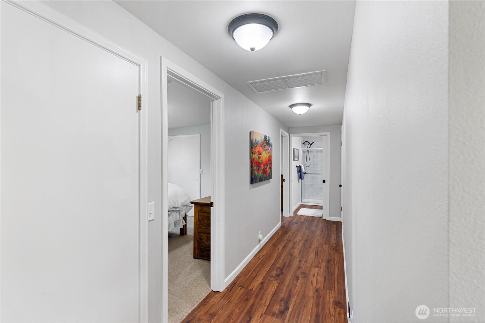 802 Haddon Road Anacortes, WA 98221 - Photo 24 of 36 a view of a hallway with wooden floor
