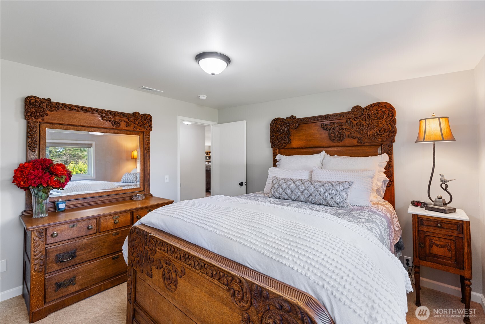 802 Haddon Road Anacortes, WA 98221 - Photo 25 of 36 a bedroom with a bed and a potted plant