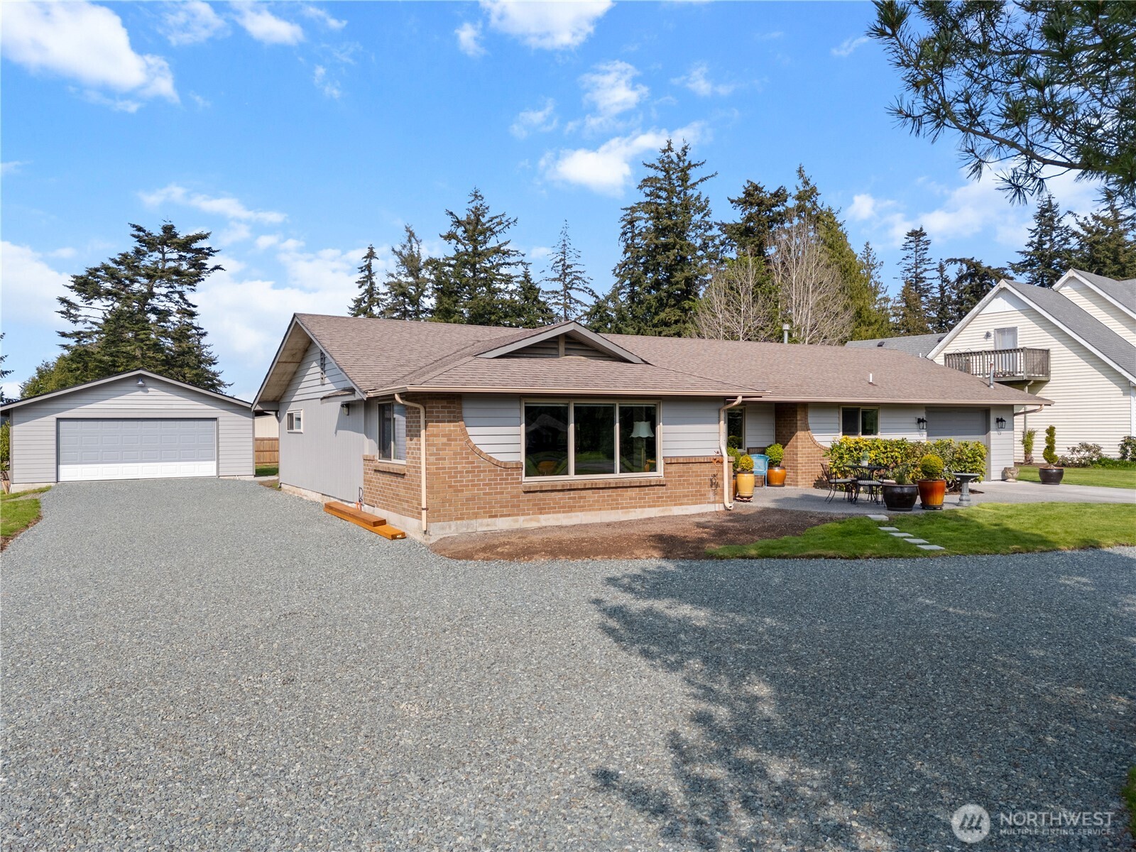 802 Haddon Road Anacortes, WA 98221 - Photo 34 of 36 a front view of a house with a yard and garage