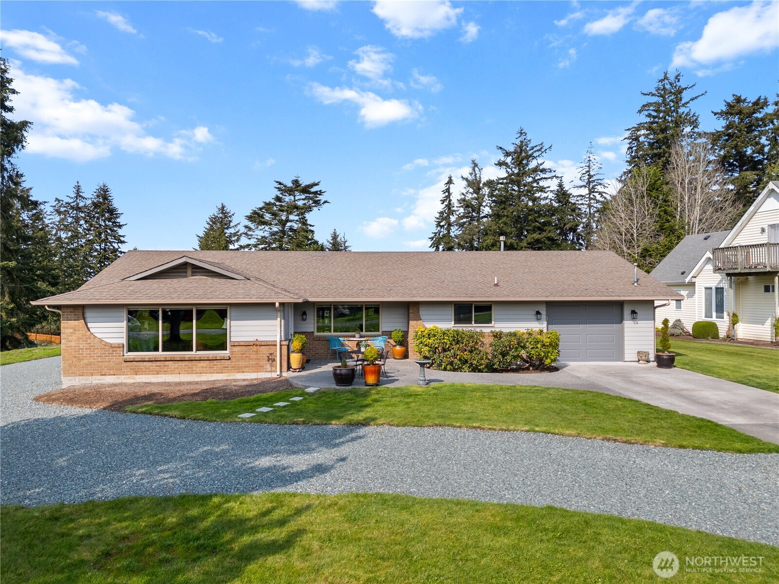 802 Haddon Road Anacortes, WA 98221 - Photo 35 of 36 a front view of a house with a yard and garage