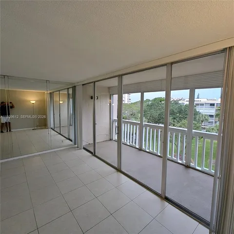 a view of an empty room with a balcony
