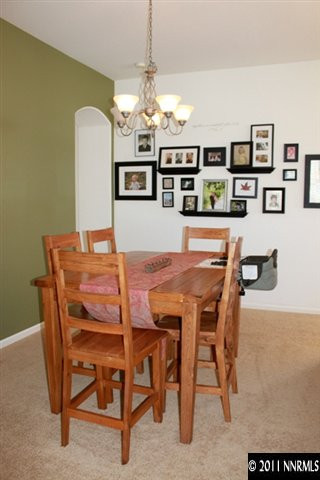 10680 Eagle Falls Way Reno, NV 89521 - Photo 5 of 8 a dining room with a table and chairs
