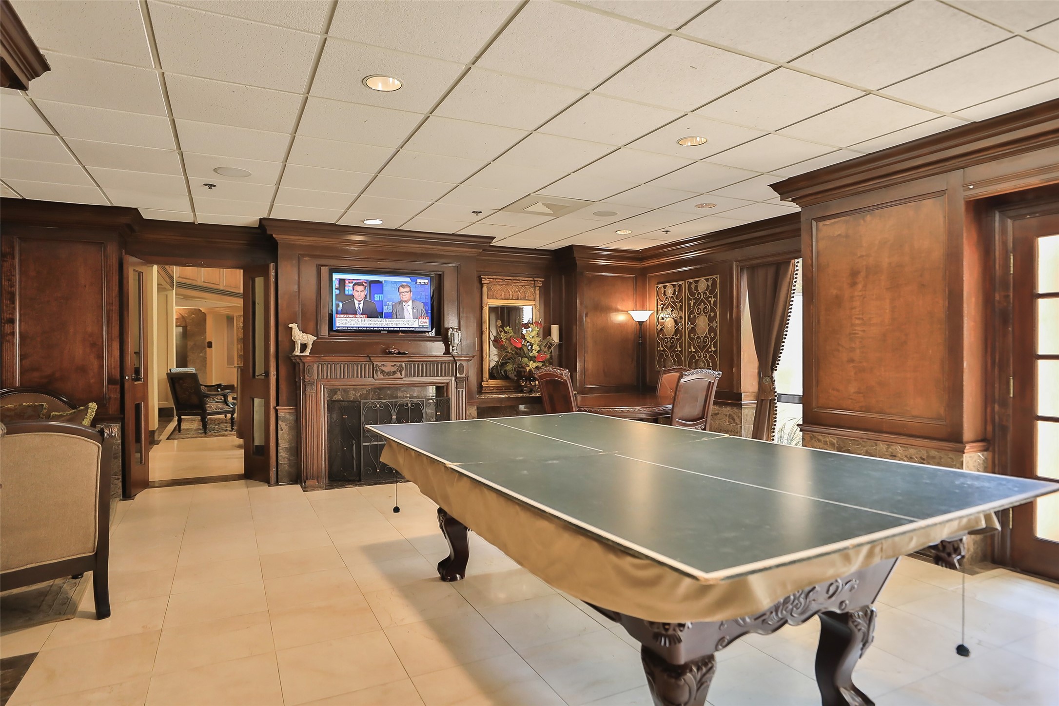 3525 Sage Road, Unit 1111 Houston, TX 77056 - Photo 14 of 18 a room with pool table a flat screen tv and windows