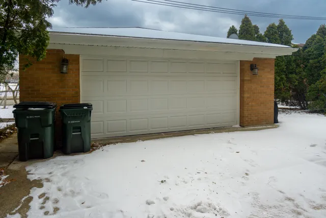 a view of a patio with a table and chairs under an umbrella