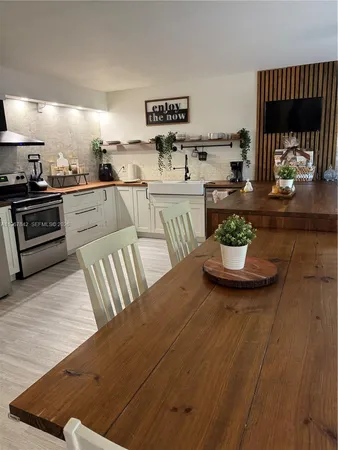 a kitchen with a table and chairs