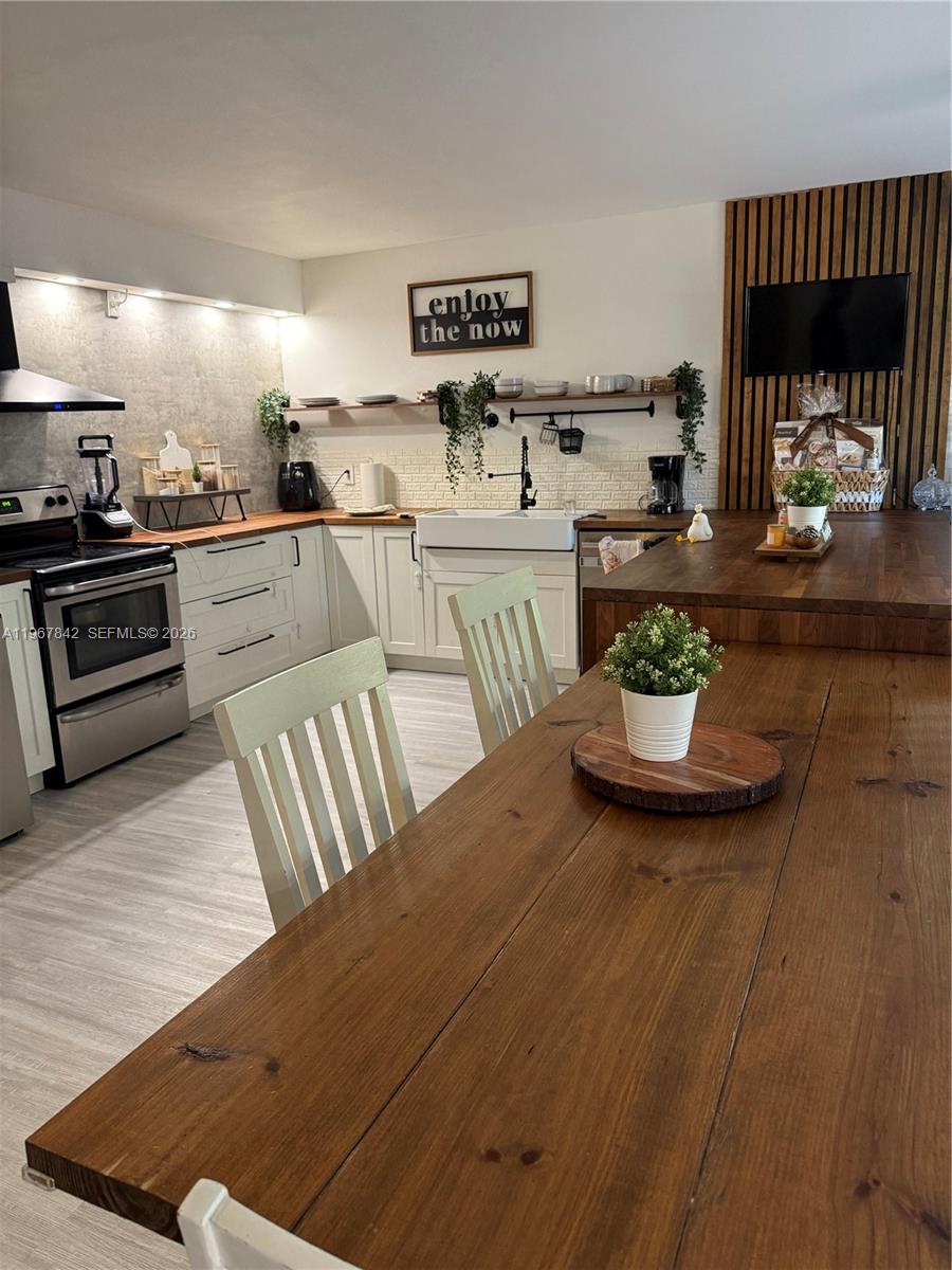 a kitchen with a table and chairs