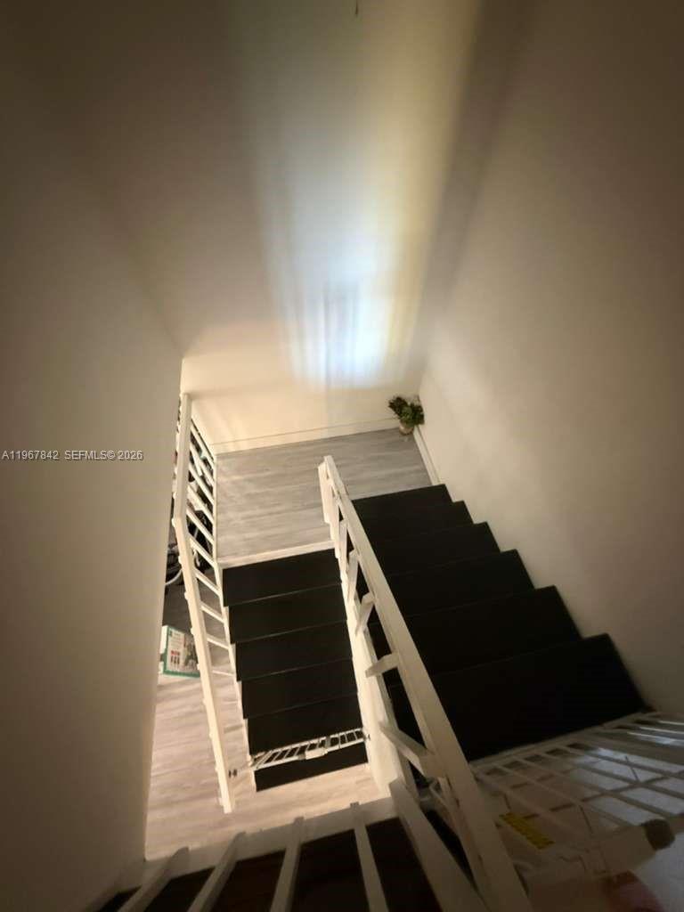 283 Woodland Road, Unit 283 Palm Springs, FL 33461 - Photo 12 of 28 a stove top oven sitting inside of a kitchen
