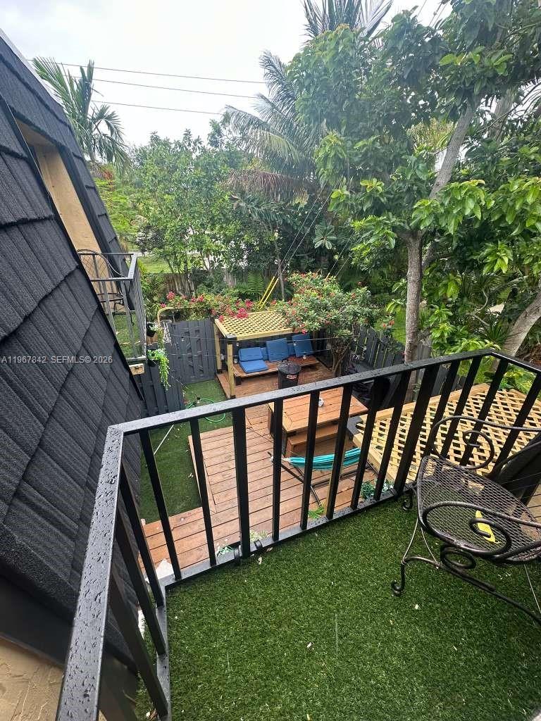 283 Woodland Road, Unit 283 Palm Springs, FL 33461 - Photo 15 of 28 a view of a two chairs in the roof deck