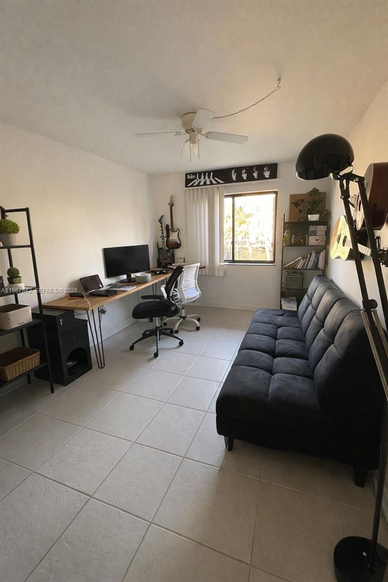 283 Woodland Road, Unit 283 Palm Springs, FL 33461 - Photo 17 of 28 a living room with furniture and a window