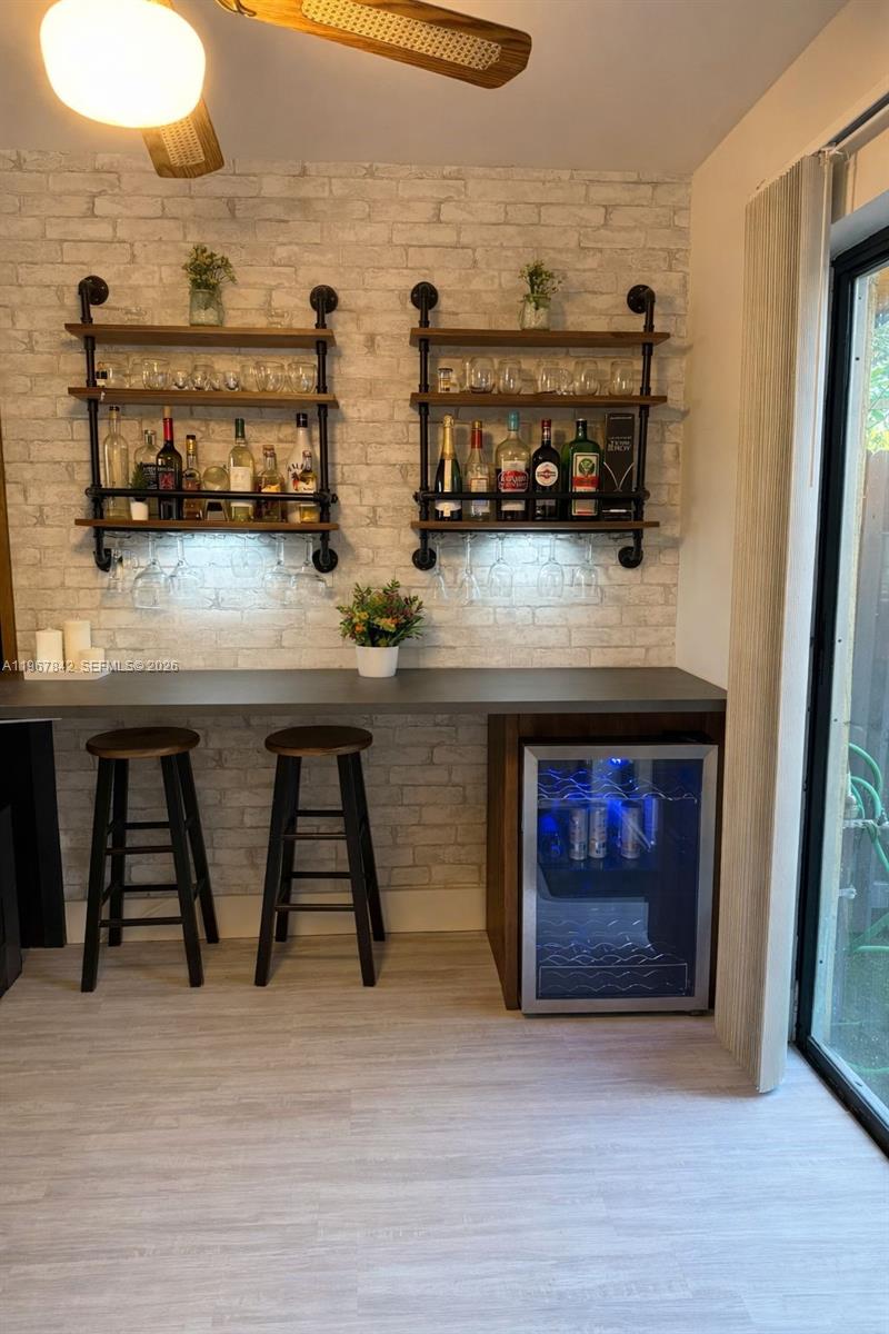 283 Woodland Road, Unit 283 Palm Springs, FL 33461 - Photo 5 of 28 a kitchen with a sink a stove and cabinets
