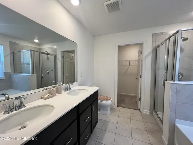 a kitchen with granite countertop stainless steel appliances a refrigerator microwave and sink