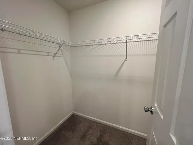 a bathroom with a tub a sink and a shower