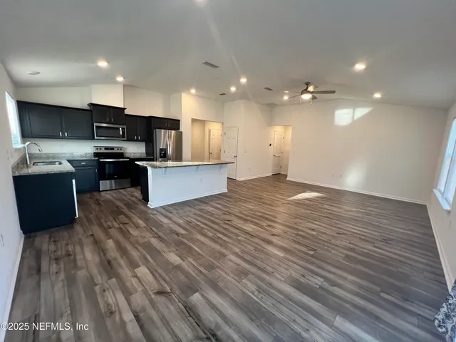 an empty room with closet area