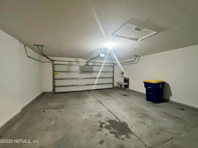 an empty room with a empty space and windows