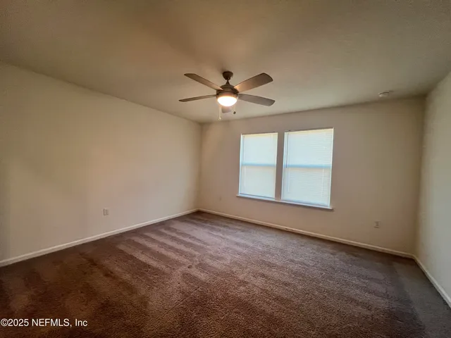 a kitchen with a refrigerator and a sink