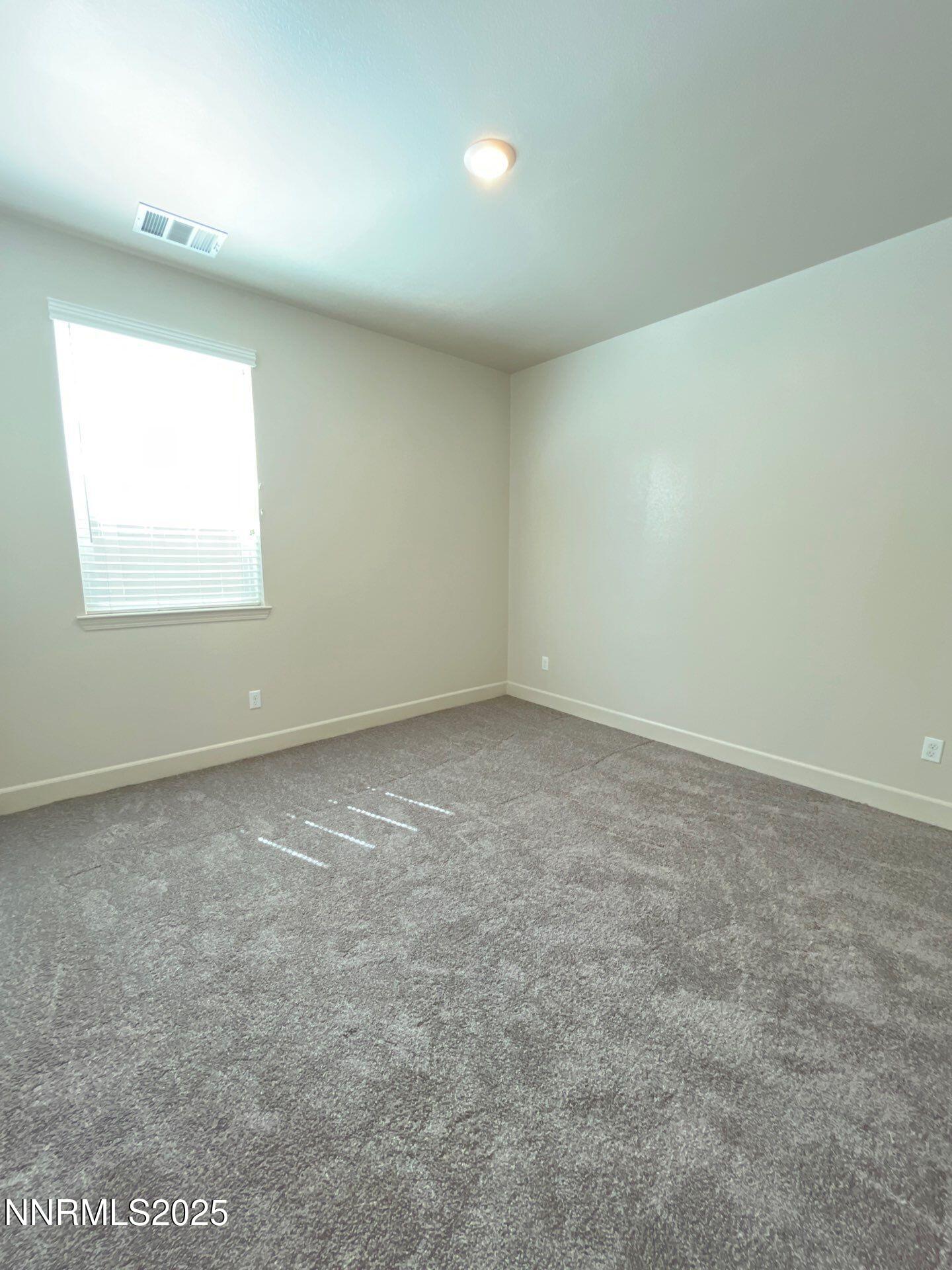1982 Maradona Drive Sparks, NV 89436 - Photo 11 of 20 an empty room with a window