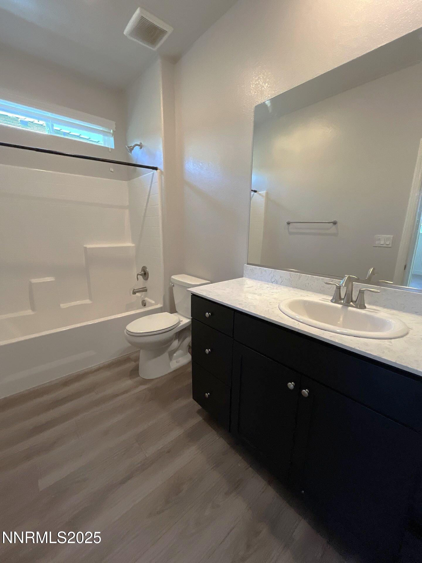 1982 Maradona Drive Sparks, NV 89436 - Photo 13 of 20 a bathroom with a double vanity sink toilet and a mirror
