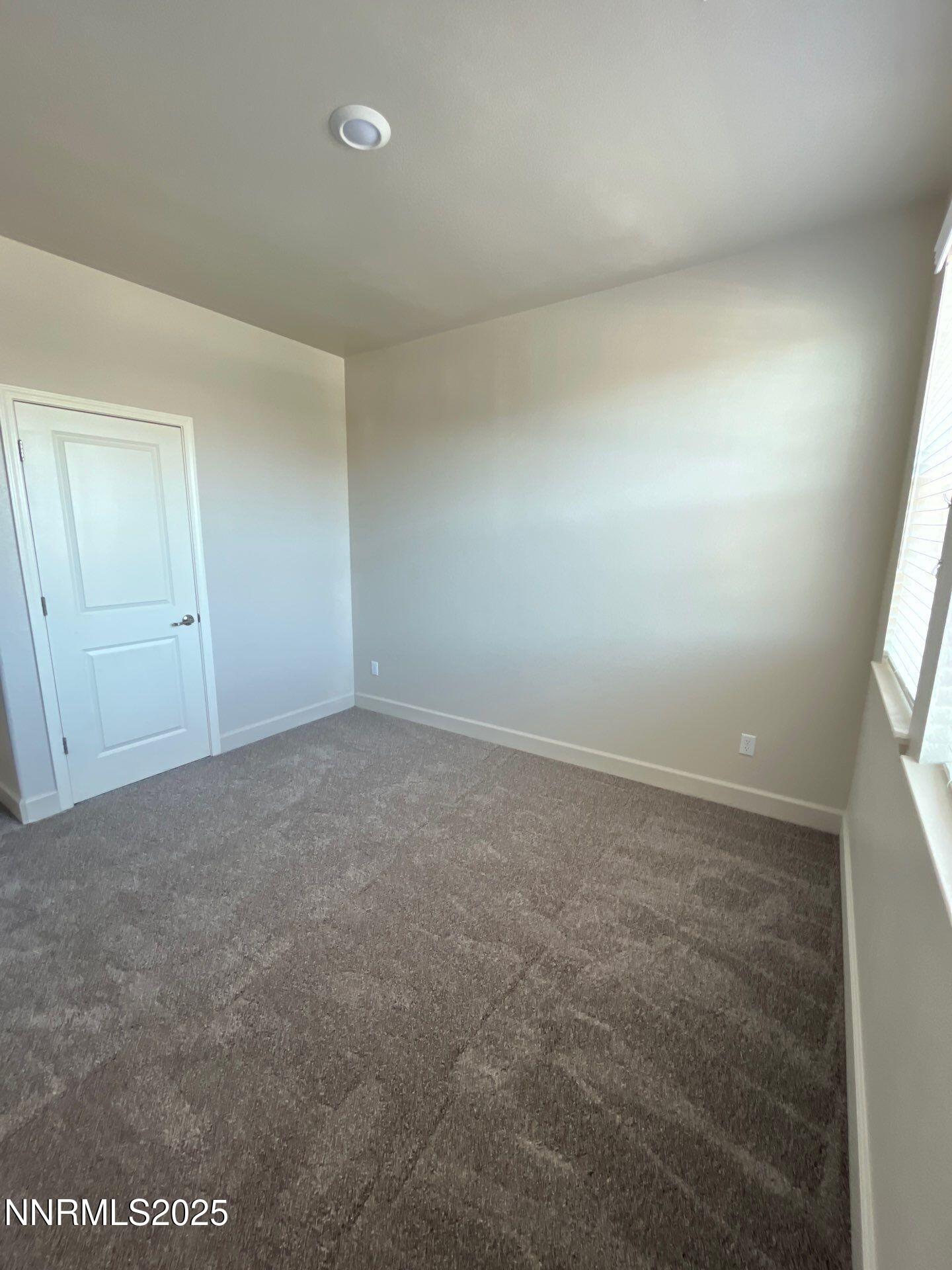 1982 Maradona Drive Sparks, NV 89436 - Photo 14 of 20 an empty room with a empty space and windows