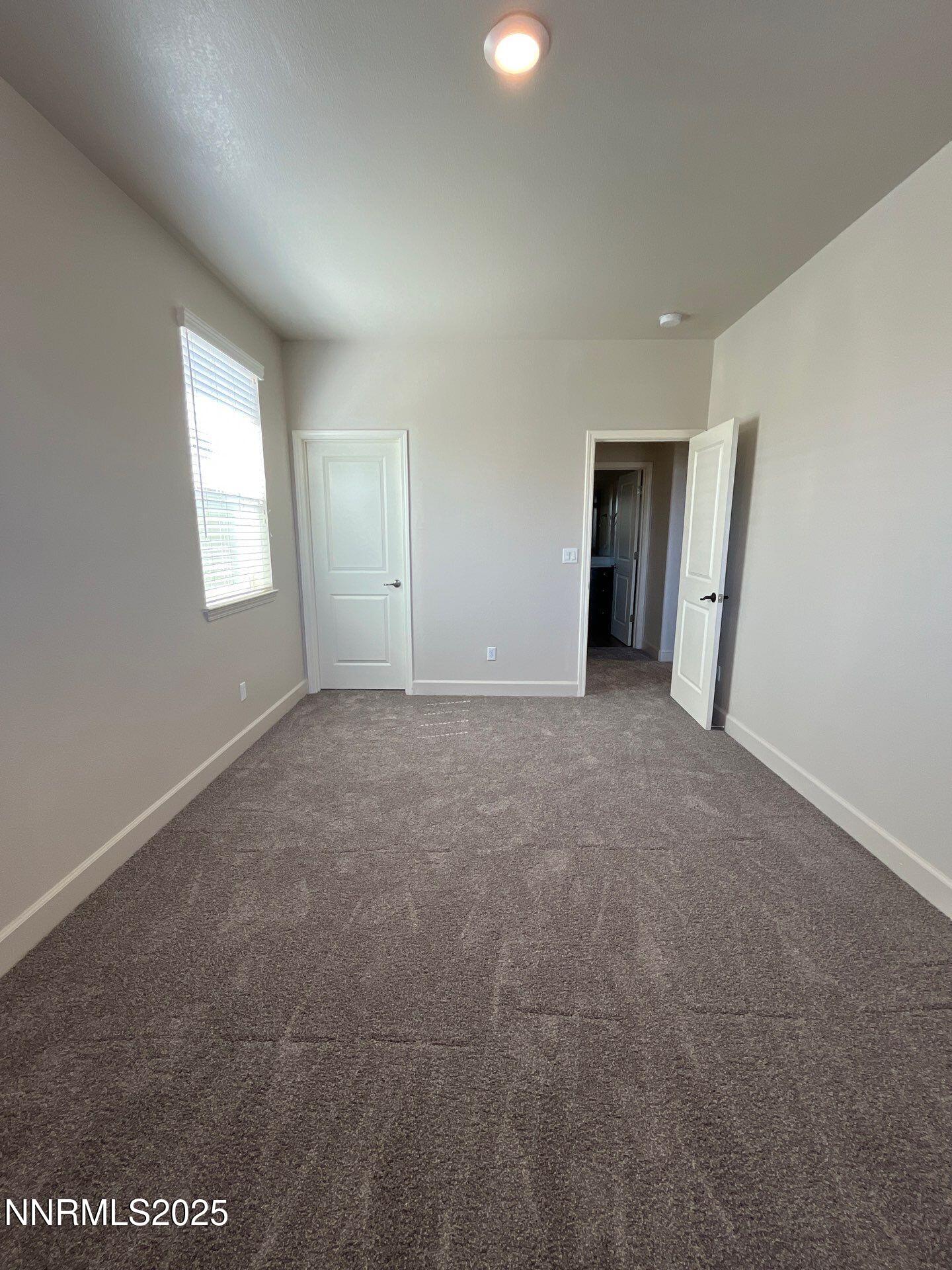 1982 Maradona Drive Sparks, NV 89436 - Photo 15 of 20 an empty room with windows and closet