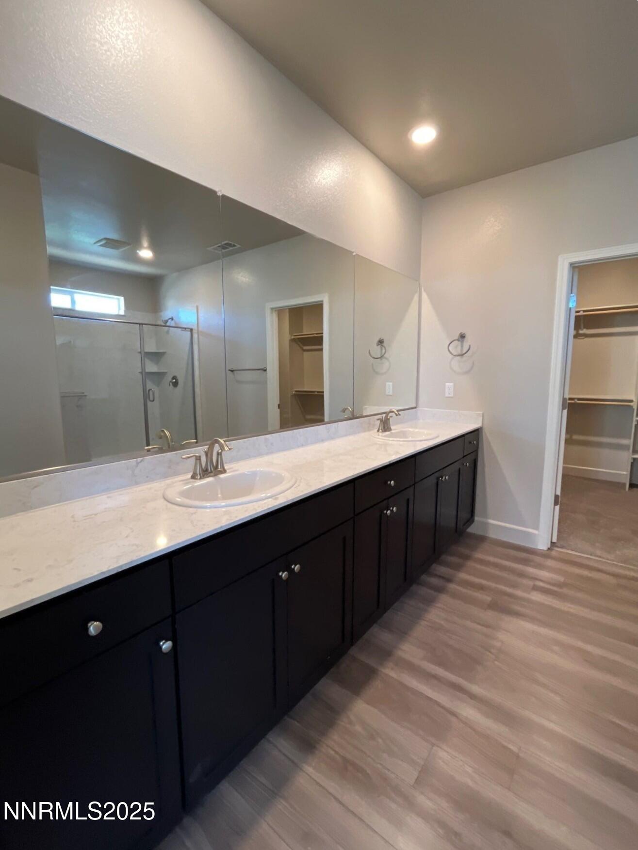 1982 Maradona Drive Sparks, NV 89436 - Photo 7 of 20 a bathroom with a double vanity sink and a mirror