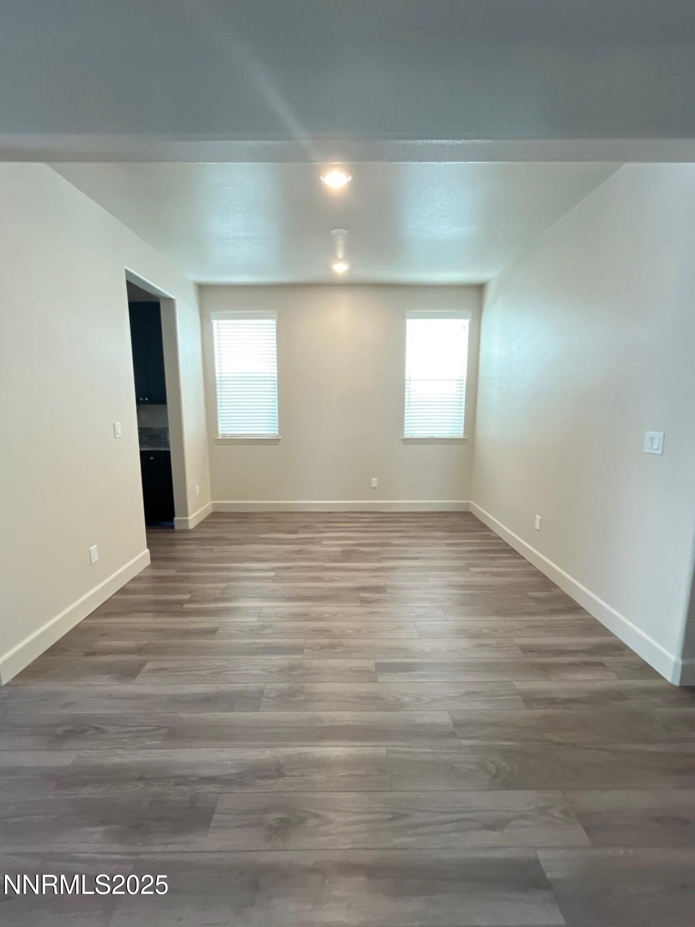 1982 Maradona Drive Sparks, NV 89436 - Photo 10 of 20 an empty room with wooden floor and windows