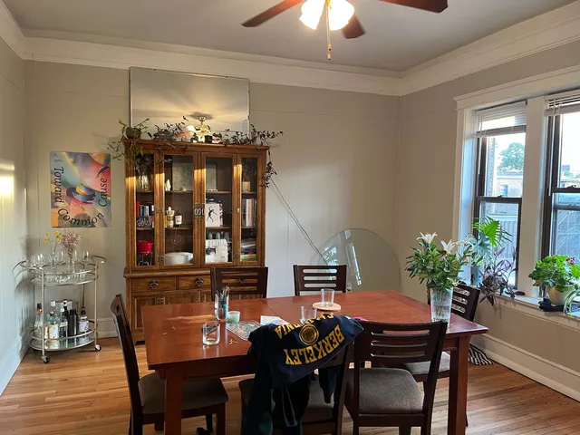 a view of a dining room with furniture and chandelier