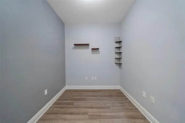 a view of room with stairs and wooden floor