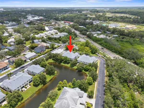 an aerial view of city and lake