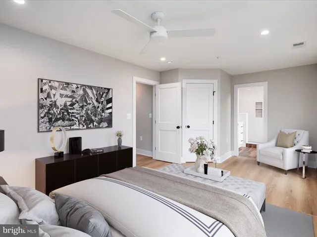 an empty room with wooden floor and closet