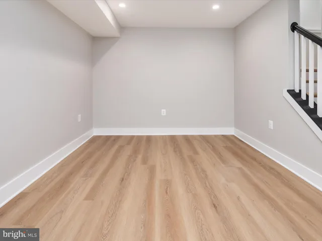 a view of an empty room with stairs