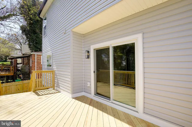 a view of a balcony with wooden fence