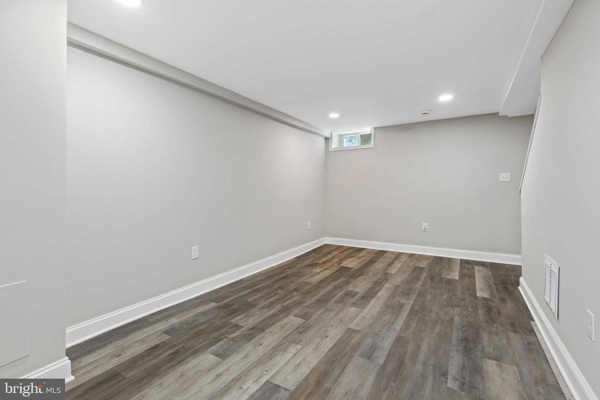 3725 Overview Road Baltimore, MD 21215 - Photo 15 of 17 a view of an empty room with wooden floor