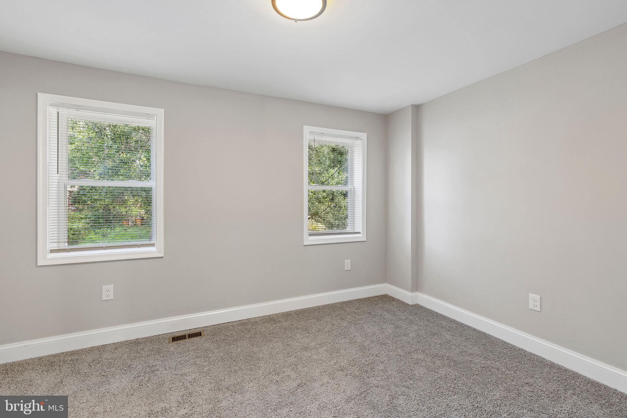 3725 Overview Road Baltimore, MD 21215 - Photo 8 of 17 an empty room with windows