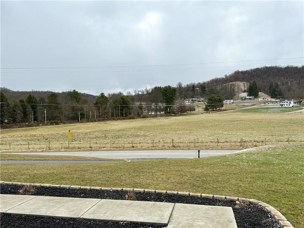 611 Fayette City Road Perryopolis, PA 15473 - Photo 4 of 39 a view of a lake with a mountain