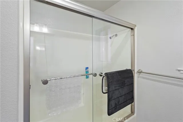 a bathroom with a shower and a sink