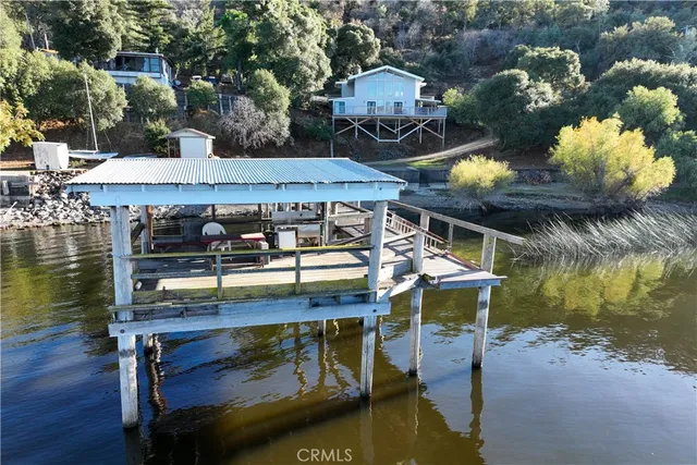 a view of a wooden deck front of house