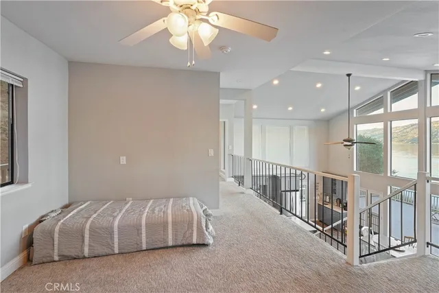 a view of backyard with a deck and wooden floor